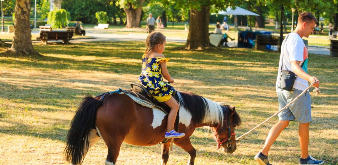 girl on a pony being led